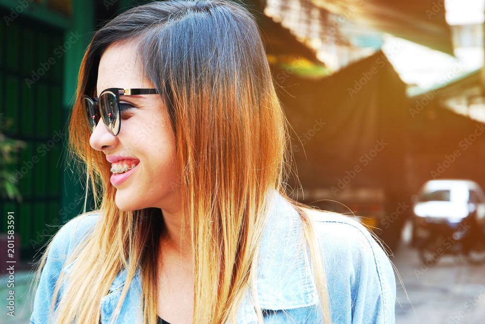 Beautiful Asia girl on fashion and building background.. Beautiful Asia girl on fashion and building background..
