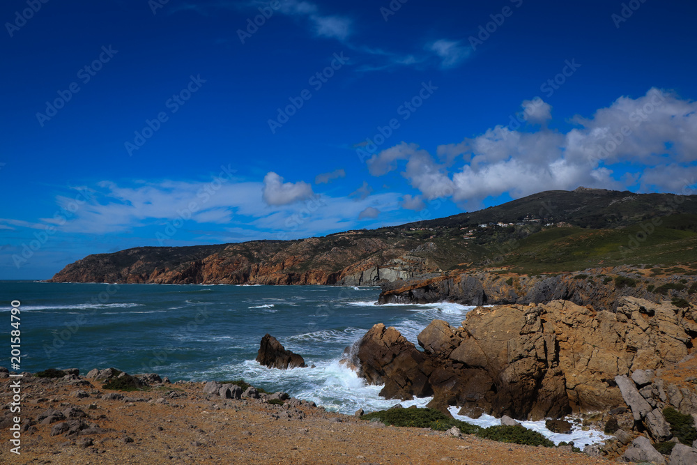 Portuguese coastline with the ocean and the sintra mountains in background. Cascais Portugal