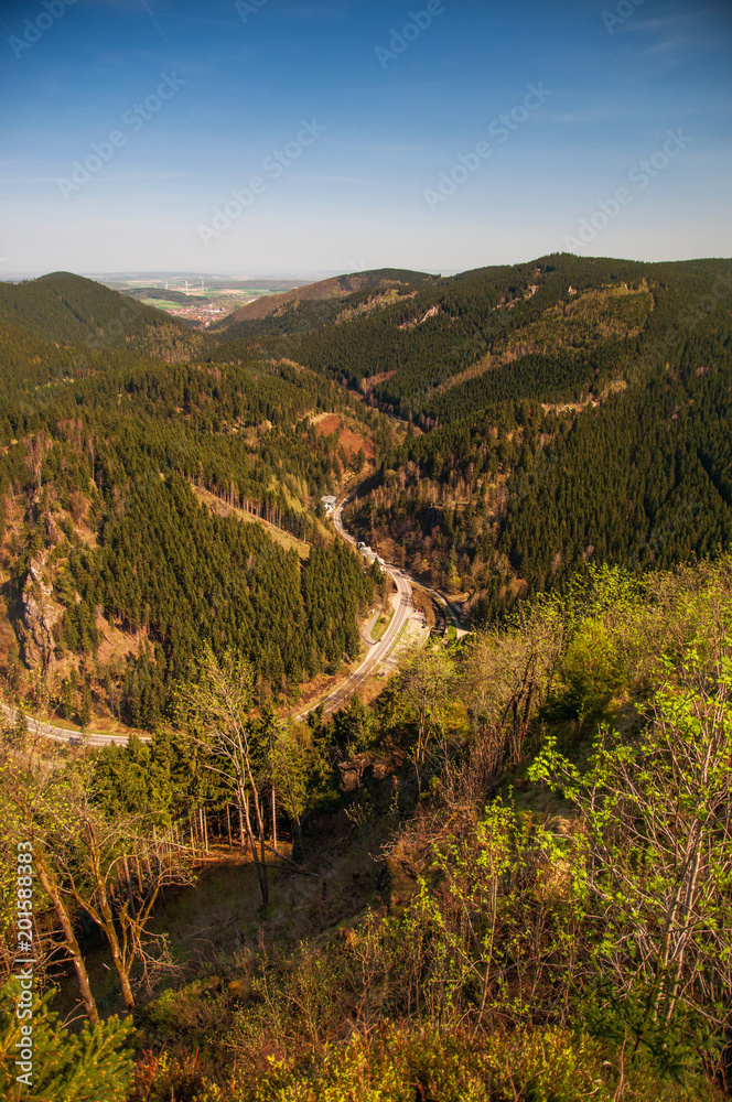 View of a s-curved mountain road in the valley from a cliff. Ahrendsberger Klippen, Okertal, Okertalsperre, Oker (Goslar) National Park Harz 