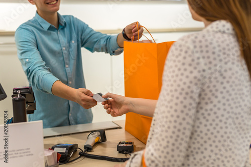 Woman paying for apparel in store