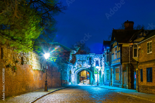 Night view of the Prince rupert gateway leading to the leicester castle and saint mary de casto church, England photo