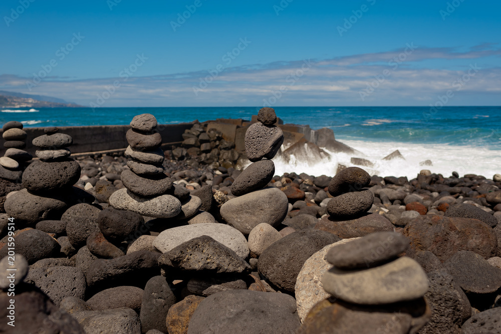 Stack of stones on the sea beach.