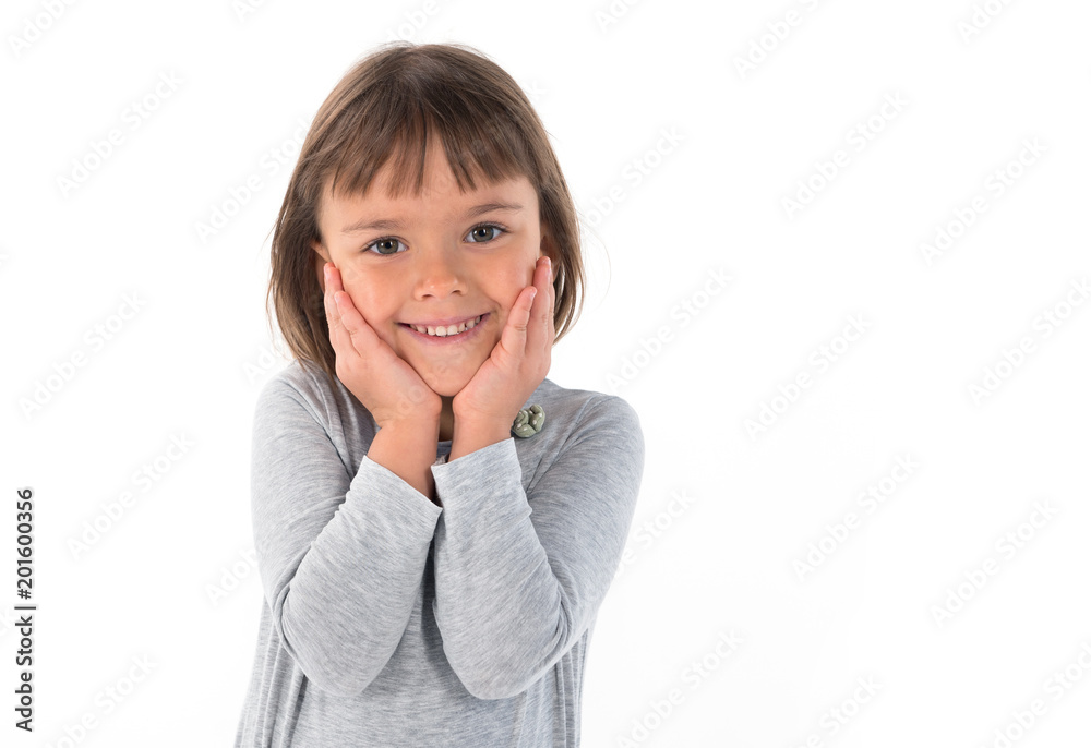 Beautiful little girl is smiling. Portrait of a child on an isolated white background. Beautiful little girl is smiling. Portrait of a child on an isolated white background.