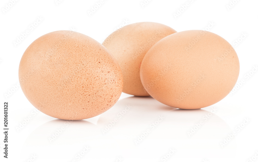 Three brown chicken eggs isolated on white background domestic. Three brown chicken eggs isolated on white background domestic.