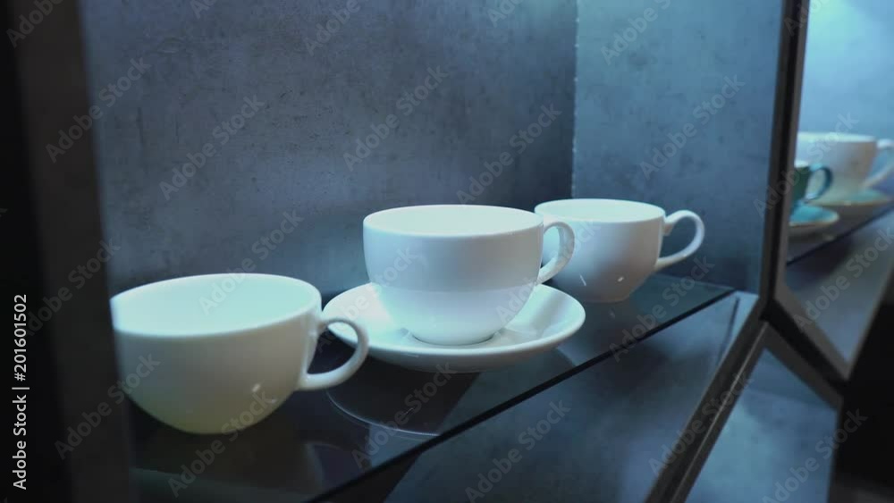 White porcelain coffee cup in a cafe or in the kitchen White porcelain coffee cup in a cafe or in the kitchen