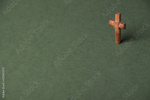 Christian cross on green background with space for writing © afanasyeva_t
