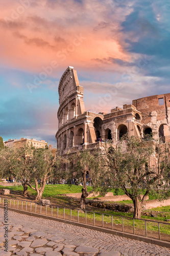 Photography Colorful sunset sky over the Coliseum in Rome, Italy.