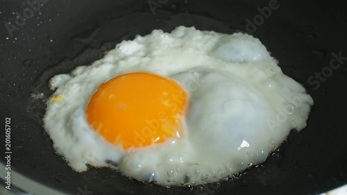 Fried organic eggs. Egg cooks menu in pan for breakfast meal.