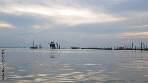 Fisheries areas villager has fish and shirm farm floating basket for keeping live fish in water at Kohyo in Songkla, Thailand (South of Thailand). This area is famous in Estuarine fisheries.