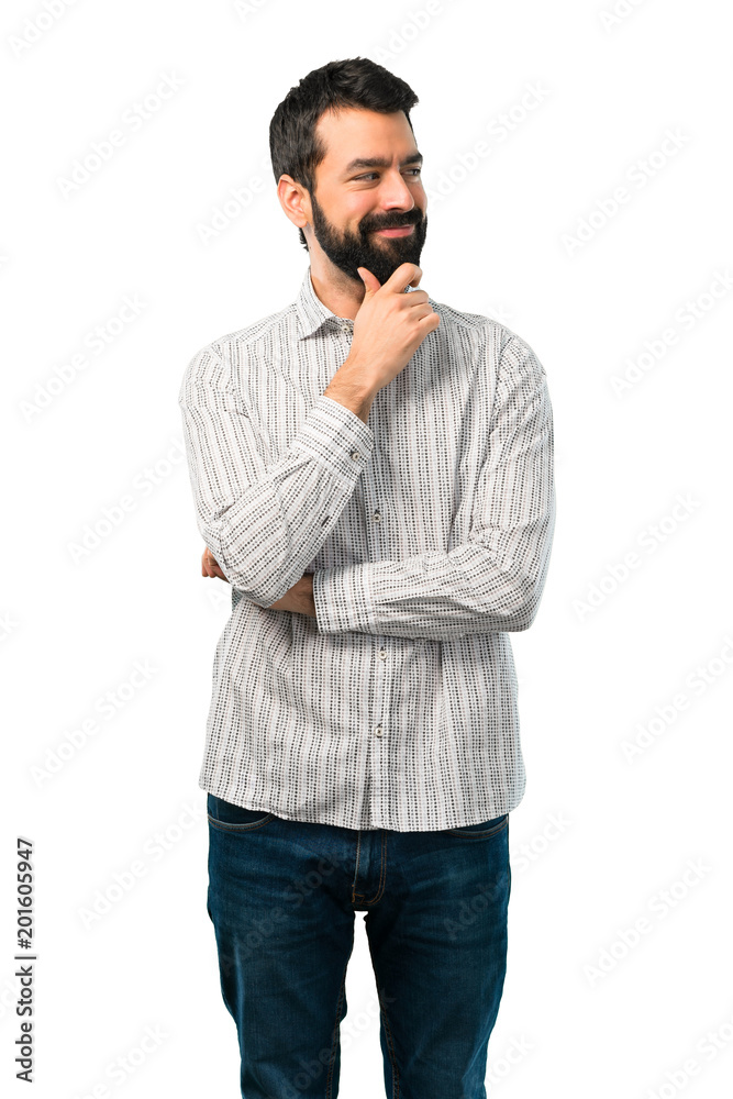 Handsome man with beard standing and looking to the side Handsome man with beard standing and looking to the side
