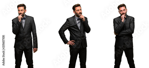 Middle age man, with beard and bow tie doubt expression, confuse and wonder concept, uncertain future