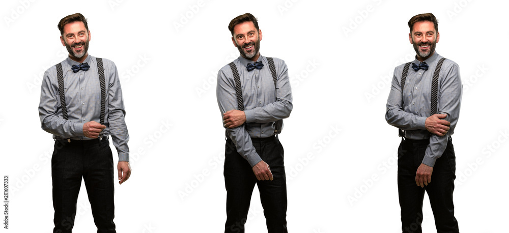 Obraz premium Middle age man, with beard and bow tie confident and happy with a big natural smile laughing