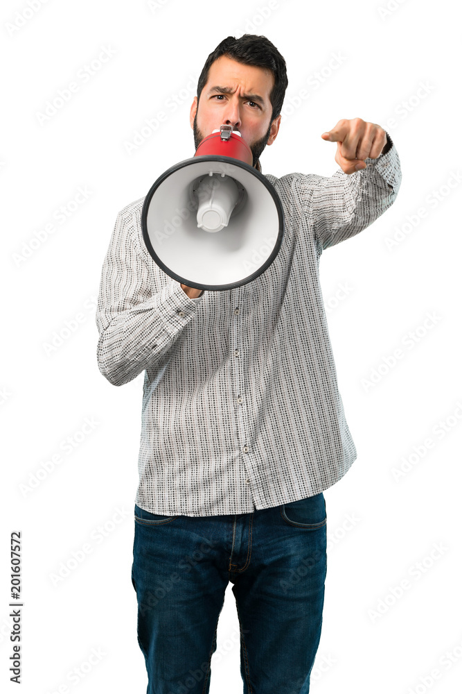 Handsome man with beard holding a megaphone Handsome man with beard holding a megaphone