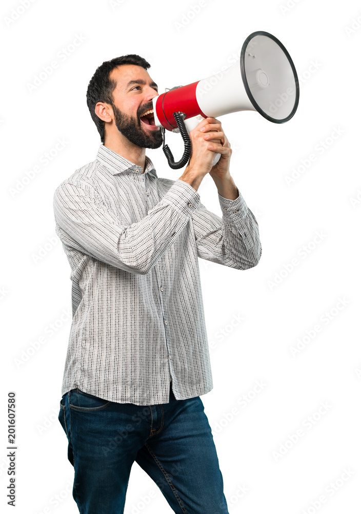 Handsome man with beard holding a megaphone Handsome man with beard holding a megaphone
