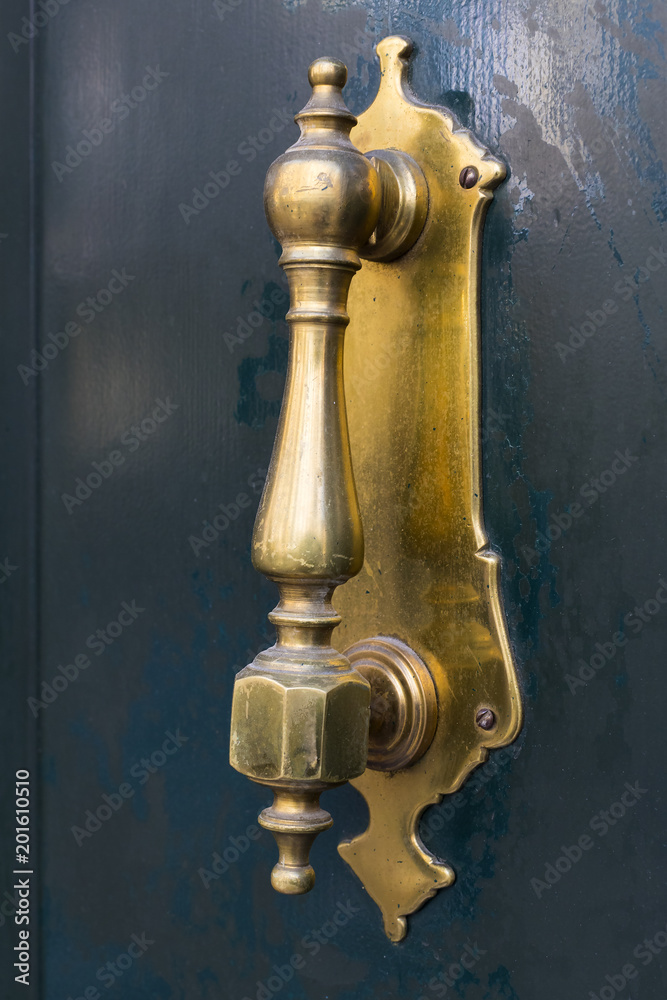 Door knocker close-up on a wooden wall Door knocker close-up on a wooden wall