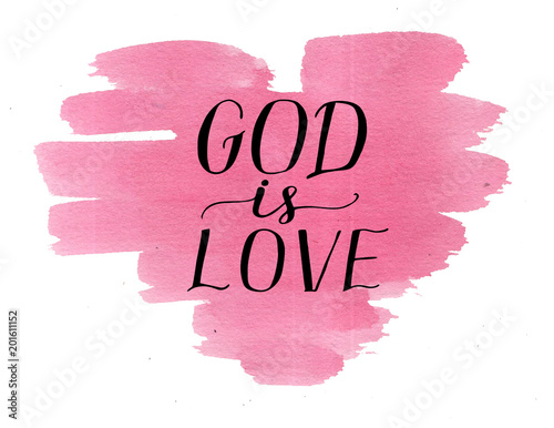 Hand lettering God is love on watercolor pink heart.