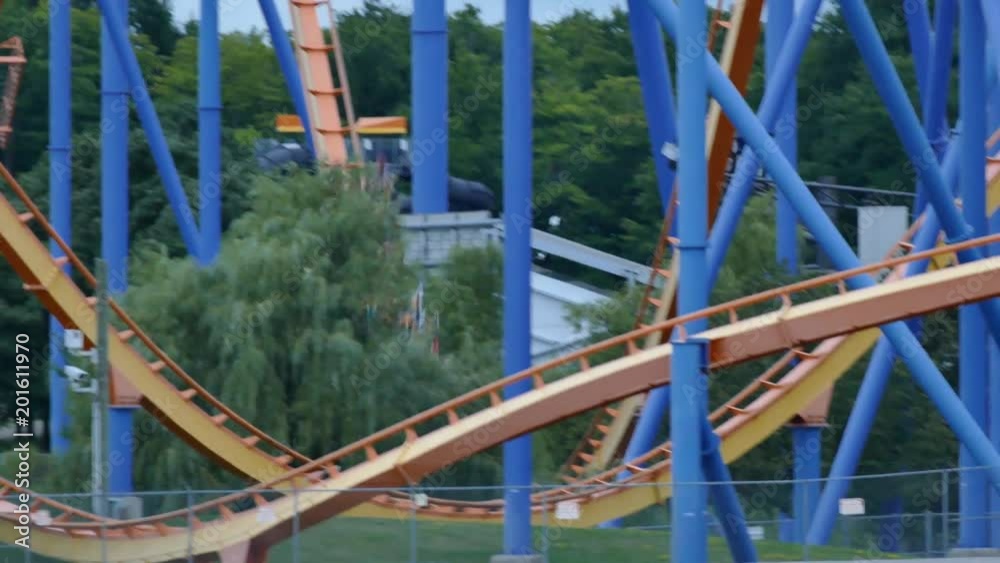 People riding on a roller coaster having fun People riding on a roller coaster having fun