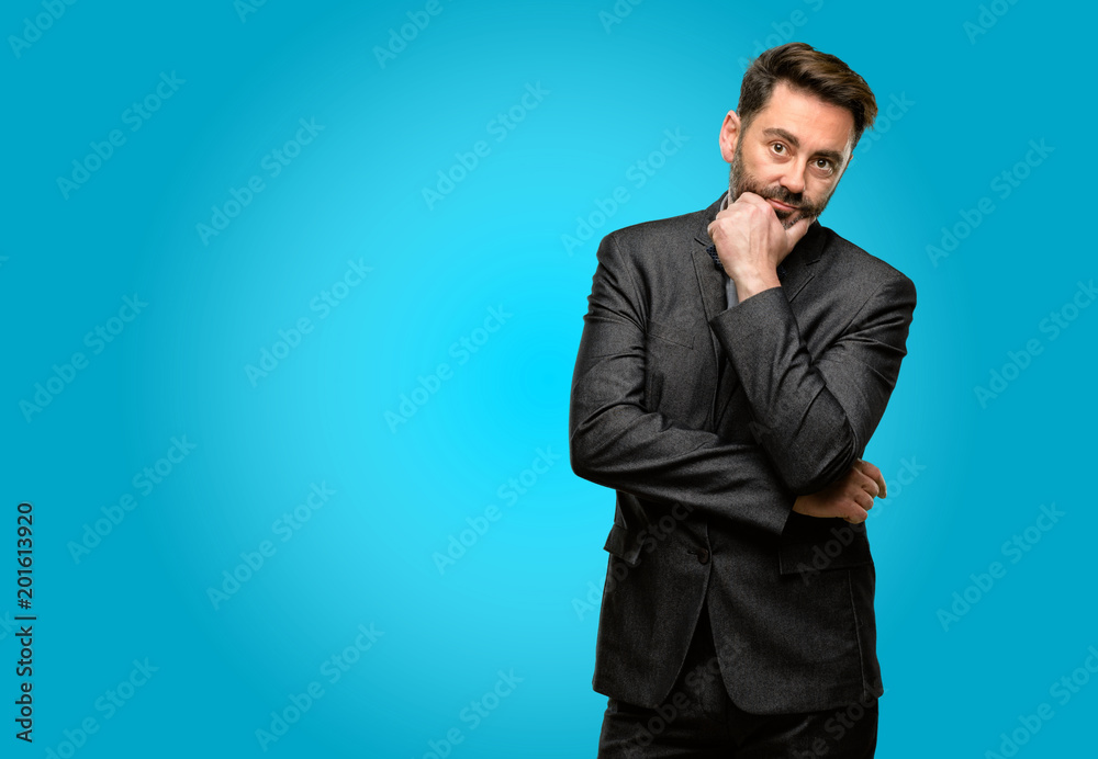 Middle age man, with beard and bow tie thinking thoughtful with smart face Middle age man, with beard and bow tie thinking thoughtful with smart face