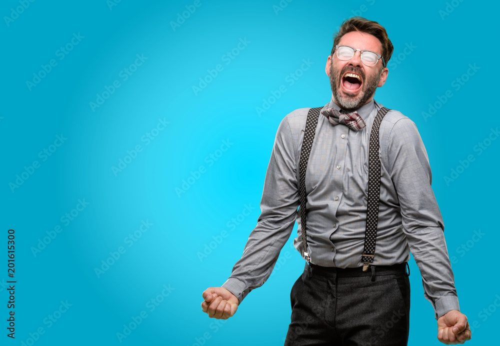 Middle age man, with beard and bow tie stressful, terrified in panic, shouting exasperated and frustrated. Unpleasant gesture. Annoying work drives me crazy Middle age man, with beard and bow tie stressful, terrified in panic, shouting exasperated and frustrated. Unpleasant gesture. Annoying work drives me crazy