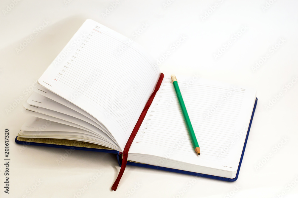 © Семен Андриенко - open notebook with pencil on white background © Семен Андриенко - open notebook with pencil on white background