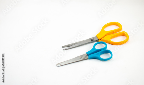 children's colorful scissors on a white background, for education.
