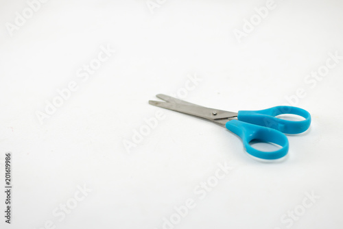 children's colorful scissors on a white background, for education.