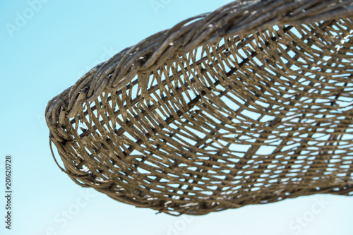 Straw umbrella on the sand beach
