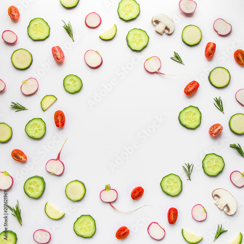 Composition of vegetables slices on white