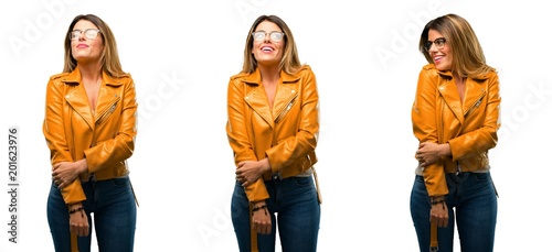 Beautiful young woman confident and happy with a big natural smile laughing looking up over white background