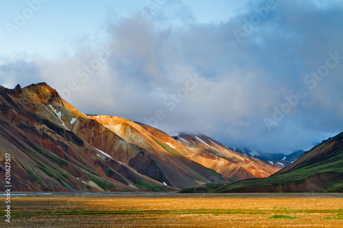 Icelandic mountain landscape at sunset. Colorful volcanic mountains in the Landmannalaugar geotermal area. One of the parts of Laugavegur trail