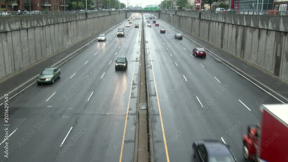 Highway with car driving on both lanes in different directions Highway with car driving on both lanes in different directions