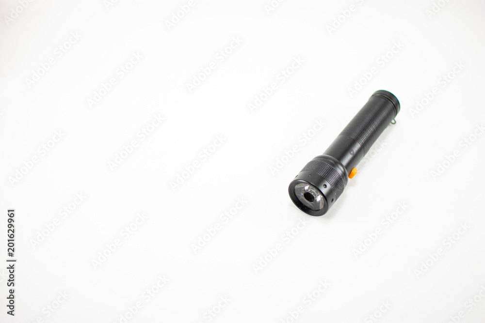 Black flashlight on white background. isolated. Black flashlight on white background. isolated.