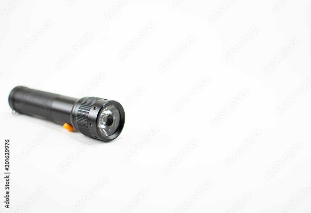 Black flashlight on white background. isolated. Black flashlight on white background. isolated.