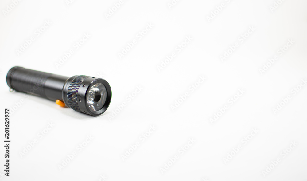 Black flashlight on white background. isolated. Black flashlight on white background. isolated.