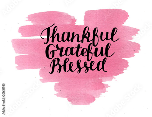 Hand lettering Thankful, grateful, blessed on watercolor heart.