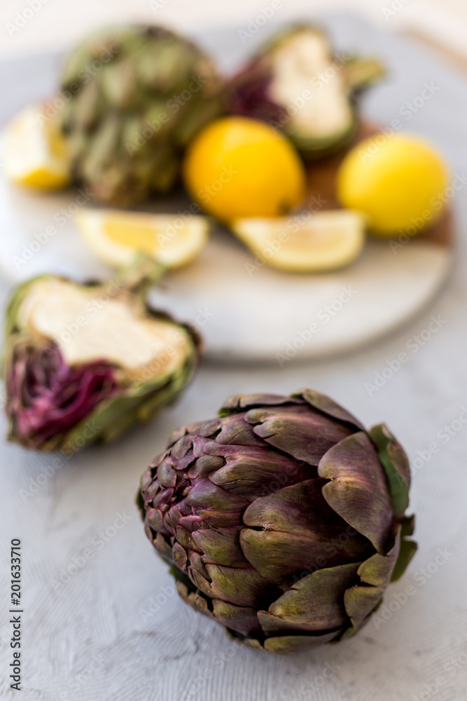 Obraz premium Healthy lifestyle. Artichokes on gray tabletop