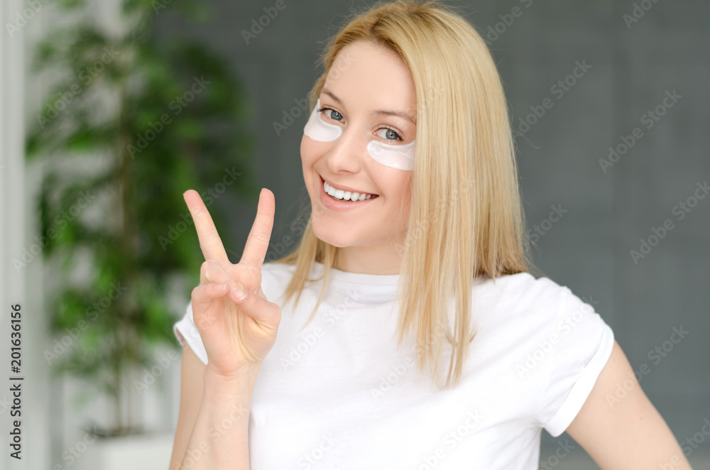 Face Skin Care. Portrait Of Beautiful Smiling Girl Removing White Under Eye Patches From Healthy Fresh Skin. Closeup Of Attractive Sexy Woman With Natural Makeup And Mask On Facial Skin. Face Skin Care. Portrait Of Beautiful Smiling Girl Removing White Under Eye Patches From Healthy Fresh Skin. Closeup Of Attractive Sexy Woman With Natural Makeup And Mask On Facial Skin.