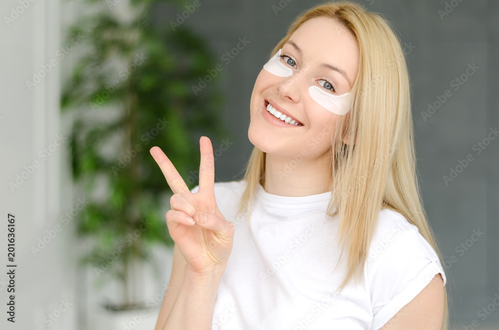 Face Skin Care. Portrait Of Beautiful Smiling Girl Removing White Under Eye Patches From Healthy Fresh Skin. Closeup Of Attractive Sexy Woman With Natural Makeup And Mask On Facial Skin. Face Skin Care. Portrait Of Beautiful Smiling Girl Removing White Under Eye Patches From Healthy Fresh Skin. Closeup Of Attractive Sexy Woman With Natural Makeup And Mask On Facial Skin.