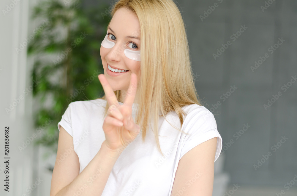 Face Skin Care. Portrait Of Beautiful Smiling Girl Removing White Under Eye Patches From Healthy Fresh Skin. Closeup Of Attractive Sexy Woman With Natural Makeup And Mask On Facial Skin. Face Skin Care. Portrait Of Beautiful Smiling Girl Removing White Under Eye Patches From Healthy Fresh Skin. Closeup Of Attractive Sexy Woman With Natural Makeup And Mask On Facial Skin.