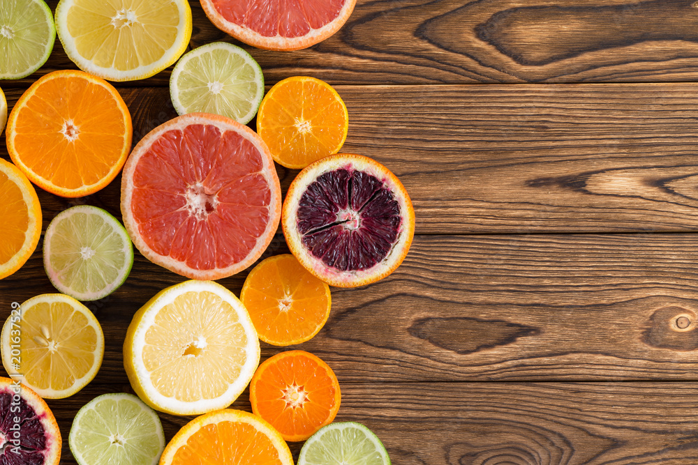 Array of fresh juicy halved citrus fruits Array of fresh juicy halved citrus fruits