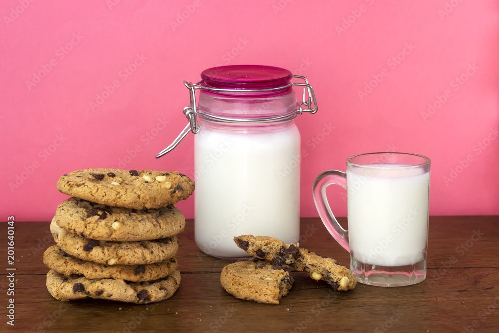 homemade white and black chocolate cookies on wood table with milk homemade white and black chocolate cookies on wood table with milk
