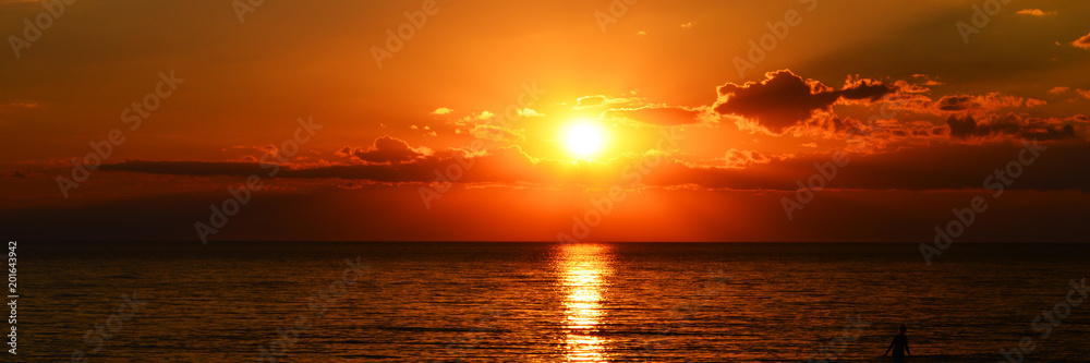 panorama of beutiful orange sunset on the calm sea