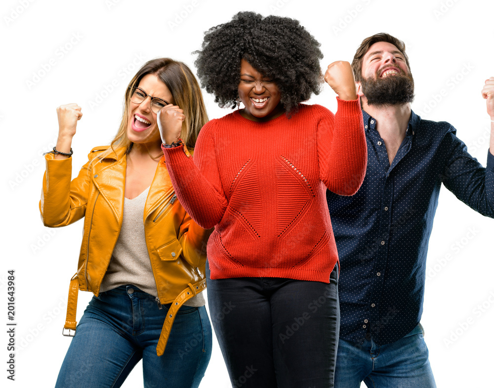 Group of three young men and women happy and excited expressing winning gesture. Successful and celebrating victory, triumphant Group of three young men and women happy and excited expressing winning gesture. Successful and celebrating victory, triumphant