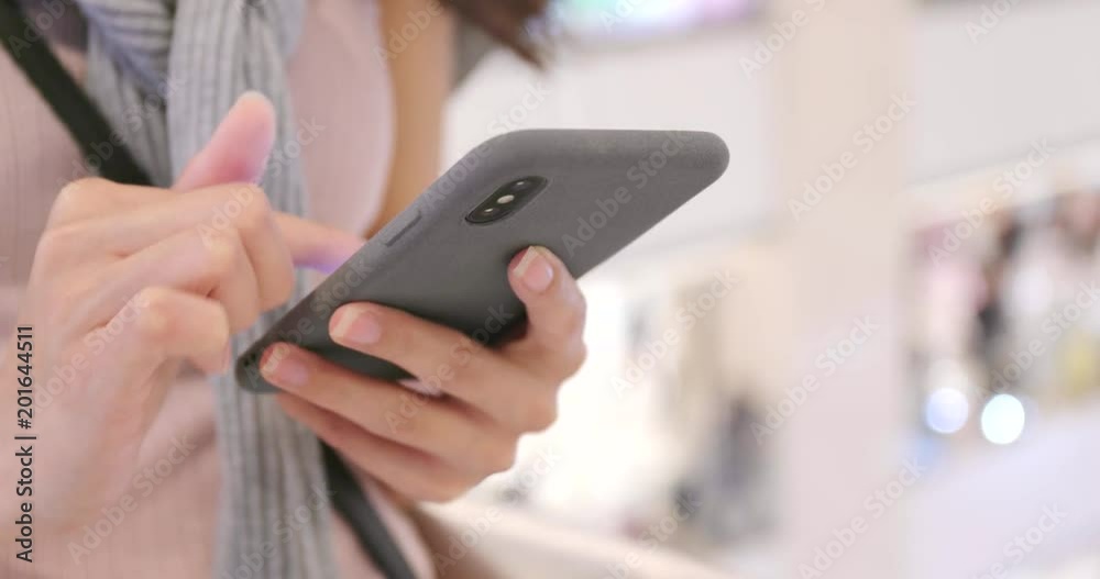 Using mobile phone in shopping mall Using mobile phone in shopping mall