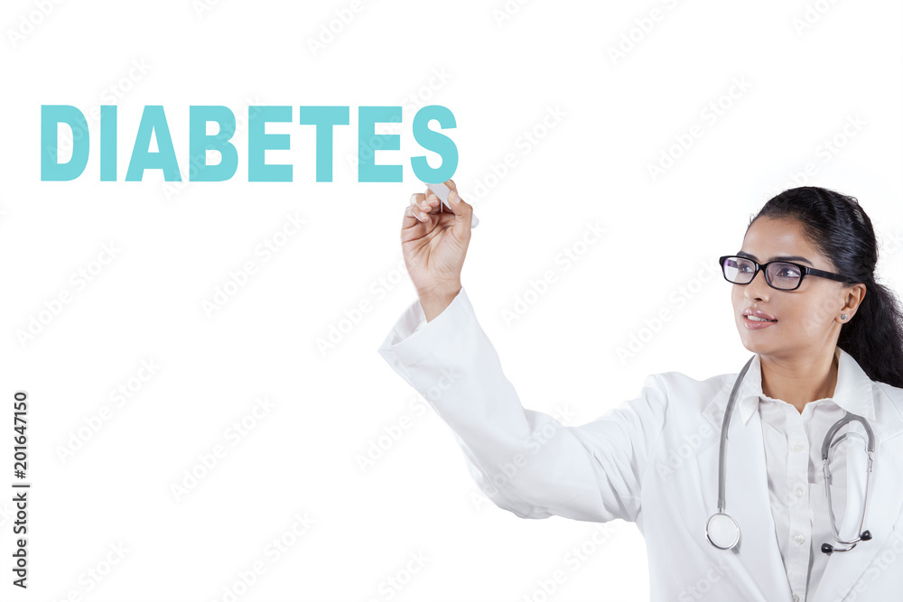 Indian female doctor writing diabetes word Indian female doctor writing diabetes word