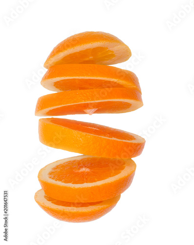 Creative concept with flying orange. Sliced orange isolated on white background. Levitating fruit