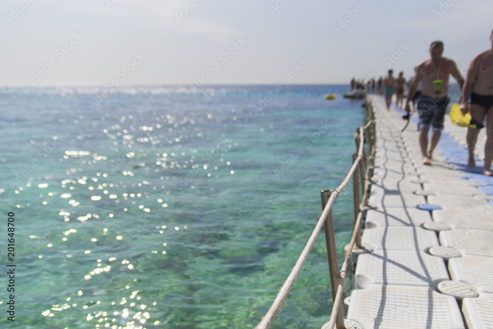 Pontoon on the red sea with a blurred background