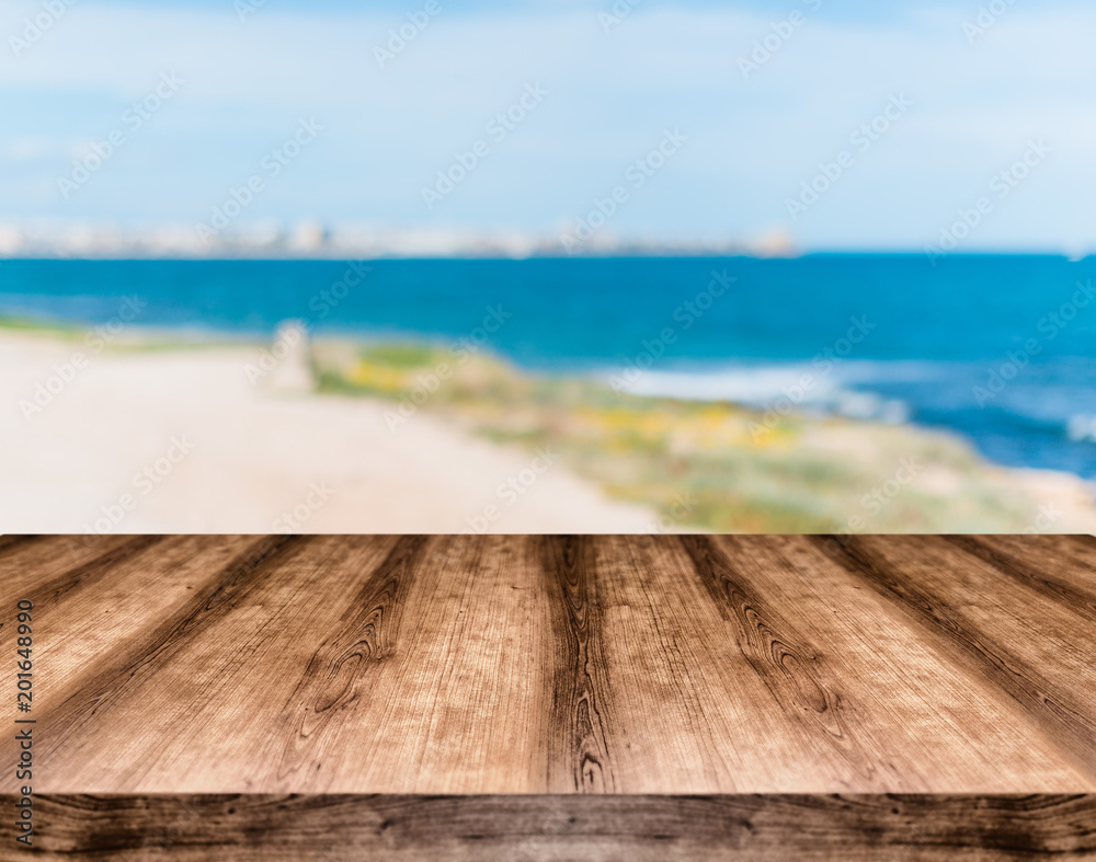 Wooden empty table board in front of blurred background. Can be used for display or montage any product. Mock up for display your product. Wooden empty table board in front of blurred background. Can be used for display or montage any product. Mock up for display your product.