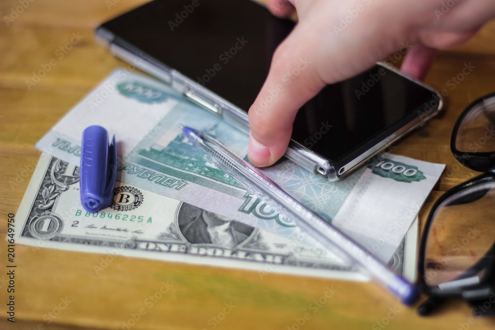 Business still life, money, pen and smartphone, glasses Business still life, money, pen and smartphone, glasses