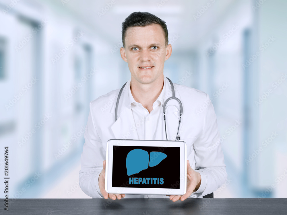 American male doctor showing hepatitis word American male doctor showing hepatitis word